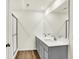 Bathroom featuring double sinks with chrome faucets and modern vanity at 7152 Jackson Dr, Cumberland, IN 46229