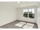 This bedroom features neutral walls and carpet and a large window at 7152 Jackson Dr, Cumberland, IN 46229
