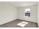 This bedroom features neutral walls and carpet and a large window at 7152 Jackson Dr, Cumberland, IN 46229