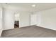 This bedroom features neutral walls and carpet, a bathroom, and a closet at 7152 Jackson Dr, Cumberland, IN 46229