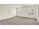 This bedroom features neutral walls and carpet, and two large windows at 7152 Jackson Dr, Cumberland, IN 46229