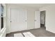 Bedroom with neutral walls and carpet, a closet, and a view to another room at 7152 Jackson Dr, Cumberland, IN 46229
