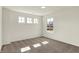 An empty bedroom featuring large windows for lots of natural light at 7152 Jackson Dr, Cumberland, IN 46229