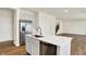 Kitchen island featuring quartz countertop and stainless steel dishwasher, great for food prep at 7152 Jackson Dr, Cumberland, IN 46229