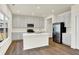 Modern kitchen featuring gray cabinetry, stainless steel appliances, and a center island at 7152 Jackson Dr, Cumberland, IN 46229