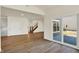 Spacious living room featuring sliding glass doors to the backyard, and a staircase at 7152 Jackson Dr, Cumberland, IN 46229