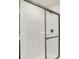 Detail of the bathroom shower with glass doors and chrome trim at 7152 Jackson Dr, Cumberland, IN 46229