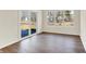Bright sunroom featuring three large windows and sliding glass doors to the outdoors at 7152 Jackson Dr, Cumberland, IN 46229
