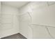 Walk-in closet with wire shelving and neutral walls and carpet at 7152 Jackson Dr, Cumberland, IN 46229