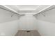 A walk-in closet designed with practical shelving and ample hanging space at 7434 King George Dr # A, Indianapolis, IN 46260