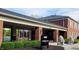Exterior view of the clubhouse with well-maintained landscaping, offering a welcoming community space at 7434 King George Dr # A, Indianapolis, IN 46260