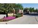 Gated entrance to Lions Head featuring manicured landscaping at 7434 King George Dr # A, Indianapolis, IN 46260