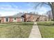 Brick two story building with well-maintained lawn at 7434 King George Dr # A, Indianapolis, IN 46260