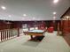 Spacious game room featuring a pool table and comfortable seating, perfect for entertaining guests at 7434 King George Dr # A, Indianapolis, IN 46260