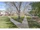 Scenic view of the landscaped grounds with walking paths, mature trees, and well-maintained lawns at 7434 King George Dr # A, Indianapolis, IN 46260