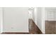 Hallway with built-in shelves and parquet floors at 7434 King George Dr # A, Indianapolis, IN 46260