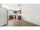 Kitchen featuring wood cabinets, laminate countertops, and white appliances at 7434 King George Dr # A, Indianapolis, IN 46260
