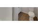 Neat and tidy half-bathroom featuring a white toilet, trim, and neutral walls at 8507 Palm Ct, Indianapolis, IN 46219