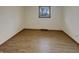 Bright bedroom features wood-look flooring, a window, and a neutral paint scheme at 8507 Palm Ct, Indianapolis, IN 46219