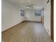 Bright bedroom with natural light, light hardwood floors and a ceiling fan, creating a comfortable and inviting space at 8507 Palm Ct, Indianapolis, IN 46219