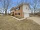 Two-story home with attached garage and spacious driveway, set in a landscaped yard at 8507 Palm Ct, Indianapolis, IN 46219