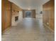 Expansive living room boasting a brick fireplace, wood paneling, and an open view to the bright, white kitchen at 8507 Palm Ct, Indianapolis, IN 46219