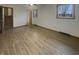Inviting living room with natural light, featuring wood-look flooring and neutral paint, ready for personal touches at 8507 Palm Ct, Indianapolis, IN 46219