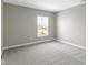 Bright and airy bedroom featuring carpet, neutral paint, and a window for natural light at 903 E 16Th St, Indianapolis, IN 46202