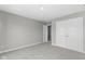 Spacious bedroom featuring neutral carpet, white trim, and multiple closets for ample storage at 903 E 16Th St, Indianapolis, IN 46202