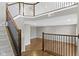 Open entryway boasts hardwood floors, a staircase with dark wood and light gray accents at 903 E 16Th St, Indianapolis, IN 46202