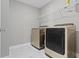 Laundry room featuring a side-by-side washer and dryer and shelving for storage at 903 E 16Th St, Indianapolis, IN 46202