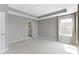 Main bedroom featuring recessed lighting, a tray ceiling, and ensuite bathroom access at 903 E 16Th St, Indianapolis, IN 46202