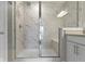 Beautiful shower featuring bright marble tile, glass enclosure, rainfall shower head, and a built-in bench at 903 E 16Th St, Indianapolis, IN 46202