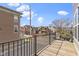 A second-story view of neighborhood homes featuring a wood deck with black metal railing at 903 E 16Th St, Indianapolis, IN 46202