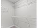 A walk-in closet featuring white wire shelving on multiple levels for optimal storage in the house at 903 E 16Th St, Indianapolis, IN 46202