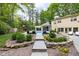 Manicured backyard with a pool, cabana, playground and lounge seating at 9080 Pickwick Dr, Indianapolis, IN 46260
