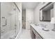 Bright bathroom with a glass-enclosed shower, gray vanity with marble countertop and silver fixtures at 9080 Pickwick Dr, Indianapolis, IN 46260