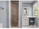 Well-lit bathroom with a glass shower, a modern vanity, and updated fixtures in a serene setting at 9080 Pickwick Dr, Indianapolis, IN 46260