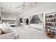 Expansive bedroom featuring built-in beds, a couch, a bookcase and comfortable lounging at 9080 Pickwick Dr, Indianapolis, IN 46260