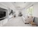 Spacious bedroom with a built-in bed, a comfy sofa, and a bright window offering natural light at 9080 Pickwick Dr, Indianapolis, IN 46260