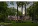 Charming two-story house with a manicured front lawn, mature trees, and inviting entrance at 9080 Pickwick Dr, Indianapolis, IN 46260