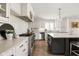 Bright kitchen with white subway tile, stainless steel appliances, and a dark-toned island at 9080 Pickwick Dr, Indianapolis, IN 46260