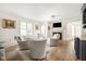 Bright living room features a fireplace, hardwood floors and neutral decor at 9080 Pickwick Dr, Indianapolis, IN 46260