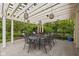 Outdoor dining space with string lights and views of the garden at 9080 Pickwick Dr, Indianapolis, IN 46260