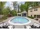 Backyard view of the beautiful pool, cabana, and play set at 9080 Pickwick Dr, Indianapolis, IN 46260