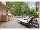 Relaxing poolside setting with outdoor kitchen and comfortable lounge chairs at 9080 Pickwick Dr, Indianapolis, IN 46260