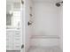 Modern shower with white subway tile and a built-in bench at 9080 Pickwick Dr, Indianapolis, IN 46260