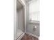Tiled shower area features white subway tiles and glass door, adjacent to a bright window at 9080 Pickwick Dr, Indianapolis, IN 46260