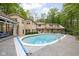 Large backyard swimming pool and patio area with lounge chairs and mature trees at 9080 Pickwick Dr, Indianapolis, IN 46260