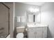 Well-lit bathroom with shower, white vanity, and a large mirror at 9303 Aintree Dr, Indianapolis, IN 46250